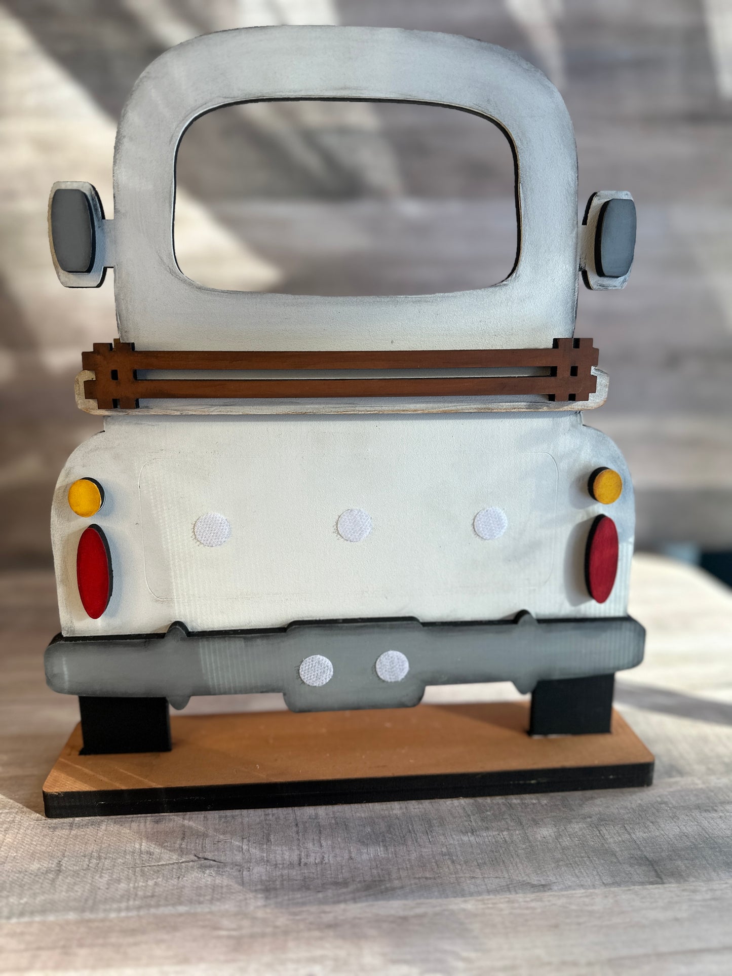 Hand-painted Farmhouse Truck used with our interchangeable inserts that can be purchased separately. Shown with out inserts. Inserts can be added easily with the hook and loop dots shown in picture.