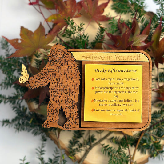 Funny mythical adhesive note holder with Bigfoot holding a butterfly. Made from Maple, Walnut, Mahogany and Cherry woods. Engraved with the qwords "Believe in yourself"