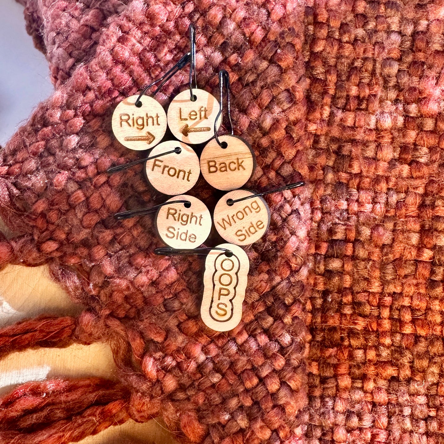 Wooden stitch markers for right, left, front, back, right side, and wrong side with a bonus OOPS marker. 