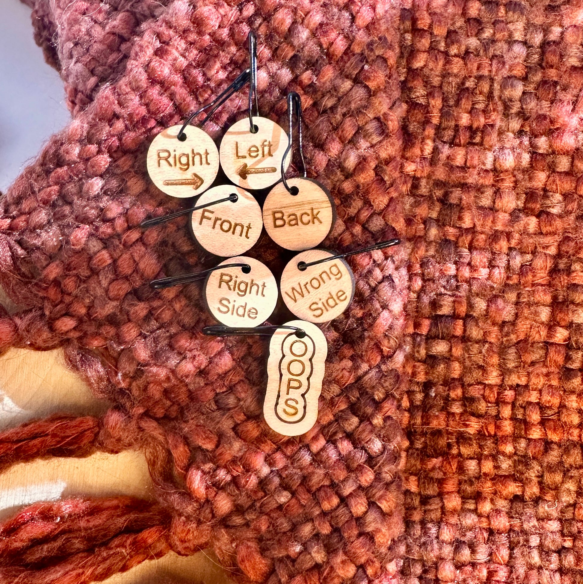 Wooden stitch markers for right, left, front, back, right side, and wrong side with a bonus OOPS marker. 