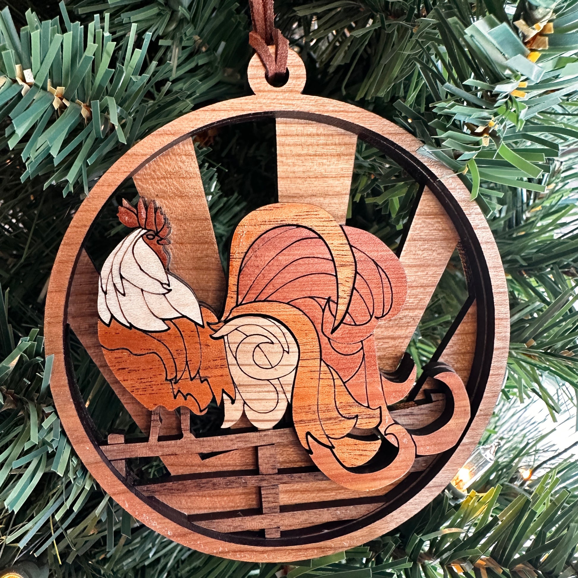Layered wooden  rooster ornament made with multiple species of wood. 