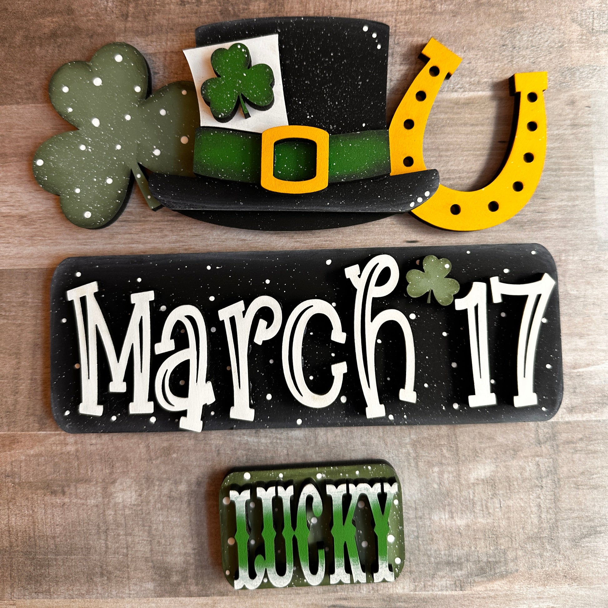 
This is our St. Patrick’s Day insert that goes with our Vintage Truck. It shows a shamrock, hat and horseshoe that slides into the back of the truck's rails. The tailgate reads “March 17,” and the license plate reads “Lucky.” These items include Velcro dots, allowing them to adhere to the Velcro on the truck base. All these items are hand-painted with love. 