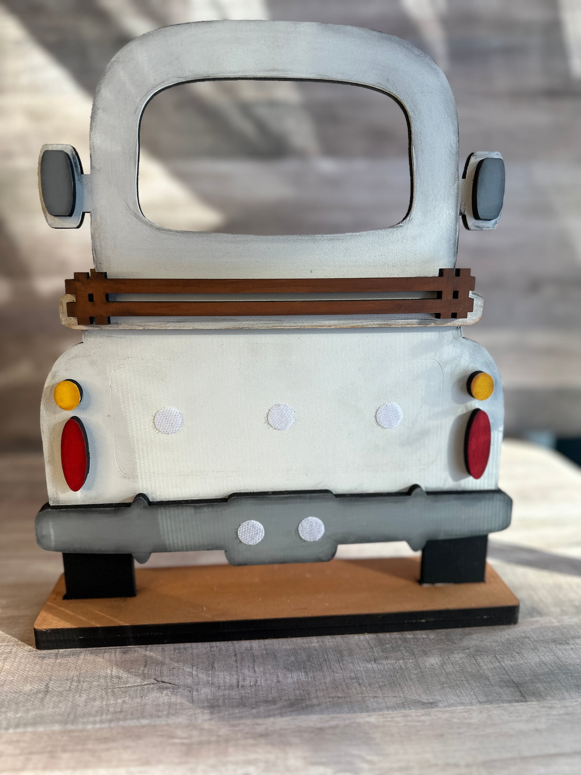 Hand-painted Farmhouse Truck used with our interchangeable inserts that can be purchased separately. Shown with out inserts. Inserts can be added easily with the hook and loop dots shown in picture.  